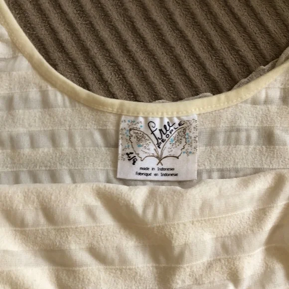 Free People NEVER WORN mini dress with ruffles. Ivory with a little bit of gold. - Picture 4 of 5